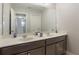 Double vanity bathroom with modern fixtures and cabinetry at 4179 Oaktree Dr, Davenport, FL 33837