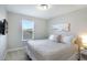 Serene bedroom with a king-size bed and a window view at 4179 Oaktree Dr, Davenport, FL 33837