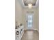 Bright and airy foyer with tile floors and a stylish console table at 4224 Prima Lago Dr, Lakeland, FL 33810