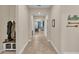 Open concept hallway with tile floors and built-in bench seating at 4224 Prima Lago Dr, Lakeland, FL 33810