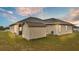 View of the home's back, showing a shed and screened patio at 4236 Dinner Lake St, Lake Wales, FL 33859