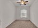 Bright bedroom with ceiling fan and neutral carpeting at 4236 Dinner Lake St, Lake Wales, FL 33859