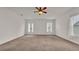 Spacious bedroom with ceiling fan and neutral carpeting at 4236 Dinner Lake St, Lake Wales, FL 33859