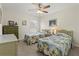 Bedroom with two twin beds, dresser, and ceiling fan at 4308 Whistlewood Cir, Lakeland, FL 33811