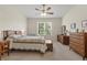 Comfortable bedroom with dresser, ceiling fan and large window at 4308 Whistlewood Cir, Lakeland, FL 33811