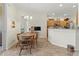 Bright dining area with kitchen access and adjacent patio view at 4308 Whistlewood Cir, Lakeland, FL 33811