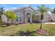 Attractive single-story home with landscaping and palm trees at 4308 Whistlewood Cir, Lakeland, FL 33811