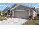 Two-car garage with neutral color scheme at 4308 Whistlewood Cir, Lakeland, FL 33811