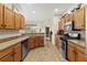 Spacious kitchen with wood cabinets and stainless steel appliances at 4308 Whistlewood Cir, Lakeland, FL 33811