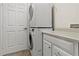 Laundry room with stacked washer and dryer at 4308 Whistlewood Cir, Lakeland, FL 33811