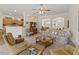 Living room with a view of the kitchen and screened patio at 4308 Whistlewood Cir, Lakeland, FL 33811