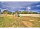 Large backyard with playground set and privacy fence at 442 Jacks Way, Davenport, FL 33837