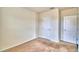 Cozy carpeted bedroom with neutral walls and a window at 442 Jacks Way, Davenport, FL 33837