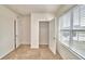 Bright bedroom featuring a large closet and window with blinds at 442 Jacks Way, Davenport, FL 33837