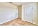 Simple bedroom with carpet, neutral walls, and ample closet space at 442 Jacks Way, Davenport, FL 33837