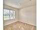 Well-lit bedroom with a window overlooking neighborhood at 442 Jacks Way, Davenport, FL 33837