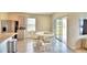 Kitchen dining area with white table and chairs, sliding doors to patio at 442 Jacks Way, Davenport, FL 33837