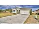 One-story home with gray siding, blue shutters, and a two-car garage at 442 Jacks Way, Davenport, FL 33837