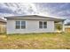 Single-story home with covered patio and fenced backyard at 442 Jacks Way, Davenport, FL 33837