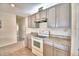 Bright kitchen boasts gray cabinets and granite countertops at 442 Jacks Way, Davenport, FL 33837