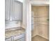 Open pantry with wire shelving offers ample storage space at 442 Jacks Way, Davenport, FL 33837