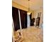 Dining area with tile floor, brown curtains, a hanging light fixture, and sliding glass doors at 4435 Fairway Oaks Dr, Mulberry, FL 33860