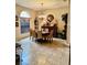 Bright dining room with a chandelier and large window at 4435 Fairway Oaks Dr, Mulberry, FL 33860