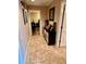 Bright hallway with tile floors and storage at 4435 Fairway Oaks Dr, Mulberry, FL 33860