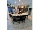 Island kitchen with granite countertops and dark wood cabinets at 4435 Fairway Oaks Dr, Mulberry, FL 33860