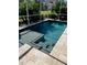 Inviting screened pool with spa and decking at 4435 Fairway Oaks Dr, Mulberry, FL 33860