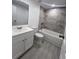 Bathroom with white vanity, toilet and bathtub at 4517 Oak St, Lakeland, FL 33813