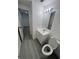 Clean bathroom with white vanity, toilet and gray floor at 4517 Oak St, Lakeland, FL 33813