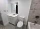 Updated bathroom with white vanity, toilet and bathtub at 4517 Oak St, Lakeland, FL 33813