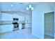 Modern kitchen with stainless steel appliances and pantry at 527 Tanaro Ln, Haines City, FL 33844