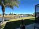 Peaceful backyard oasis with lake view and fire pit at 593 Meandering Way, Polk City, FL 33868