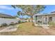 Large backyard with patio and mature tree at 6111 Morningview Dr, Lakeland, FL 33813