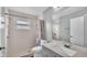 Clean bathroom with shower/tub combo and gray vanity at 6111 Morningview Dr, Lakeland, FL 33813