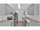 Galley kitchen with gray cabinets and granite countertops at 6111 Morningview Dr, Lakeland, FL 33813