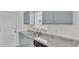 Modern kitchen with gray cabinets, granite counters, and stainless steel sink at 6111 Morningview Dr, Lakeland, FL 33813