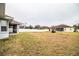 Backyard view of home and fence at 6358 Alamanda Hills Dr, Lakeland, FL 33813