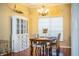 Farmhouse-style dining room with wood table and hutch at 6358 Alamanda Hills Dr, Lakeland, FL 33813