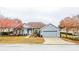 One-story home with gray siding, stone accents, and a two-car garage at 6358 Alamanda Hills Dr, Lakeland, FL 33813