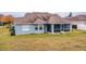 House back view, screened porch, and yard at 6358 Alamanda Hills Dr, Lakeland, FL 33813