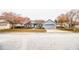 House front view with driveway and landscaping at 6358 Alamanda Hills Dr, Lakeland, FL 33813