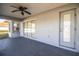 Spacious screened porch with ceiling fan and sliding glass doors at 6358 Alamanda Hills Dr, Lakeland, FL 33813