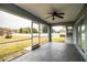 Relaxing screened porch with ceiling fan and backyard view at 6358 Alamanda Hills Dr, Lakeland, FL 33813