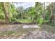 Large backyard with mature trees and open space at 638 W Thomas St, Lakeland, FL 33805