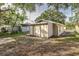 Backyard with detached building and grassy area at 638 W Thomas St, Lakeland, FL 33805