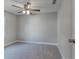 Spacious bedroom with ceiling fan and carpet at 638 W Thomas St, Lakeland, FL 33805