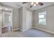 Well-lit bedroom with carpet and double closet at 638 W Thomas St, Lakeland, FL 33805